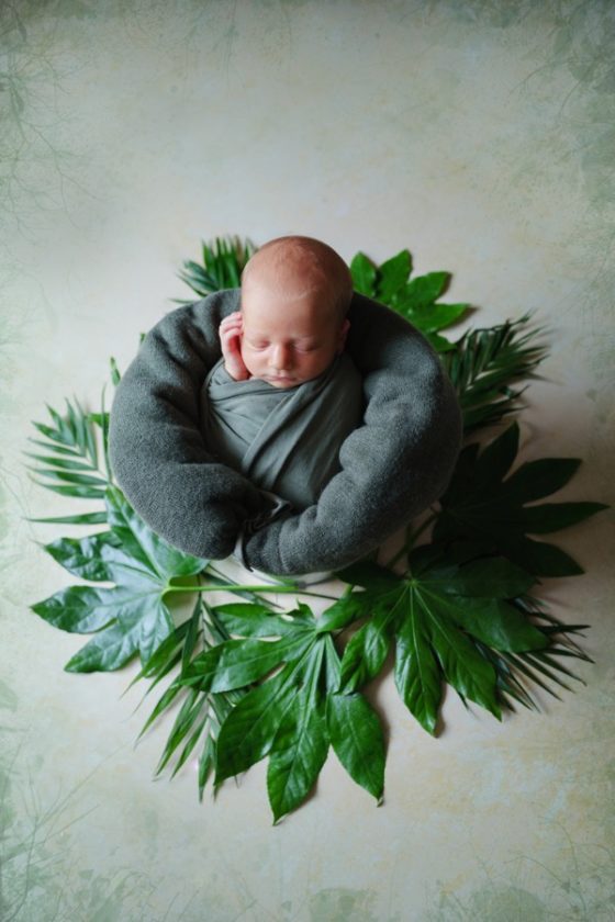 newborn with flowers
